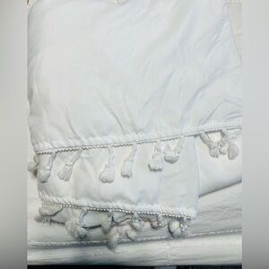 Crib bedskirt with fringe